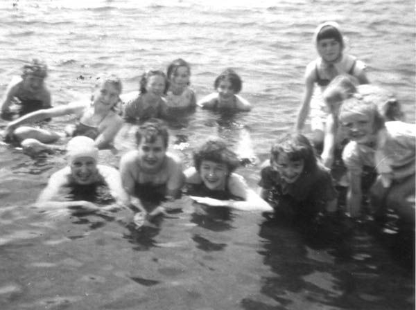 126: Swimmers in the harbour. [courtesy of Mary (Reddy) King] Photo appears to have  at least one Reddy, two Ennis's, a Bishop, a Whelan, and a Ryan